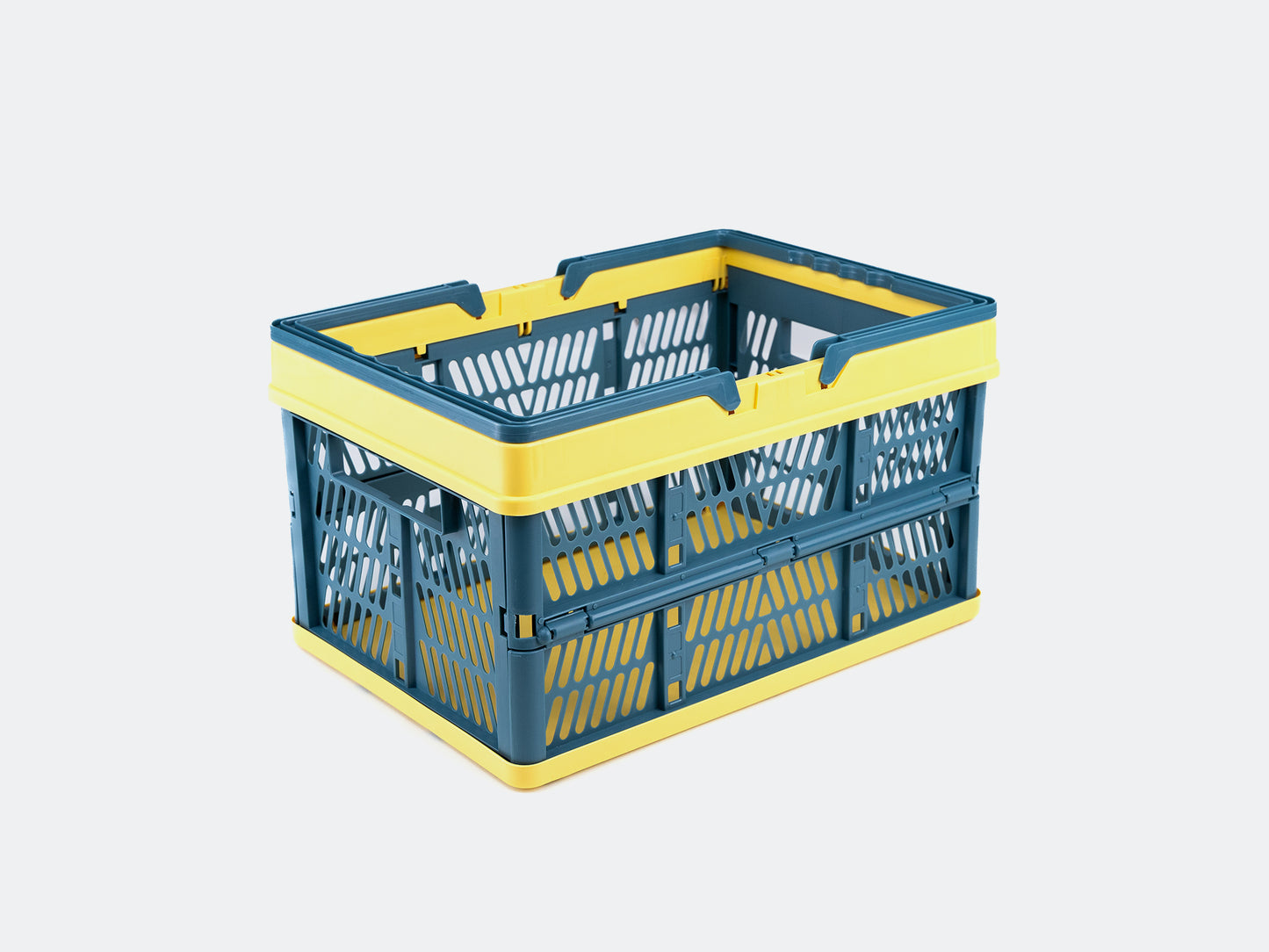 Velowave_Blue and yellow collapsible storage basket on a light gray background