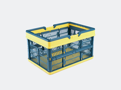 Velowave_Blue and yellow collapsible storage basket on a light gray background