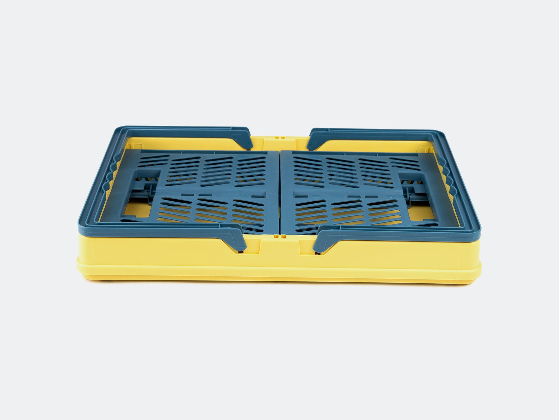 Velowave_Yellow and blue plastic crate/basket on a light gray background