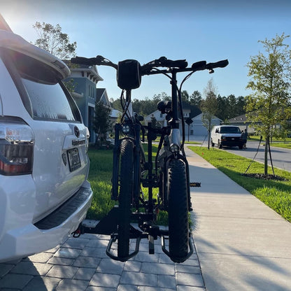 Jupiter_Bicycles attached to a car on a residential street