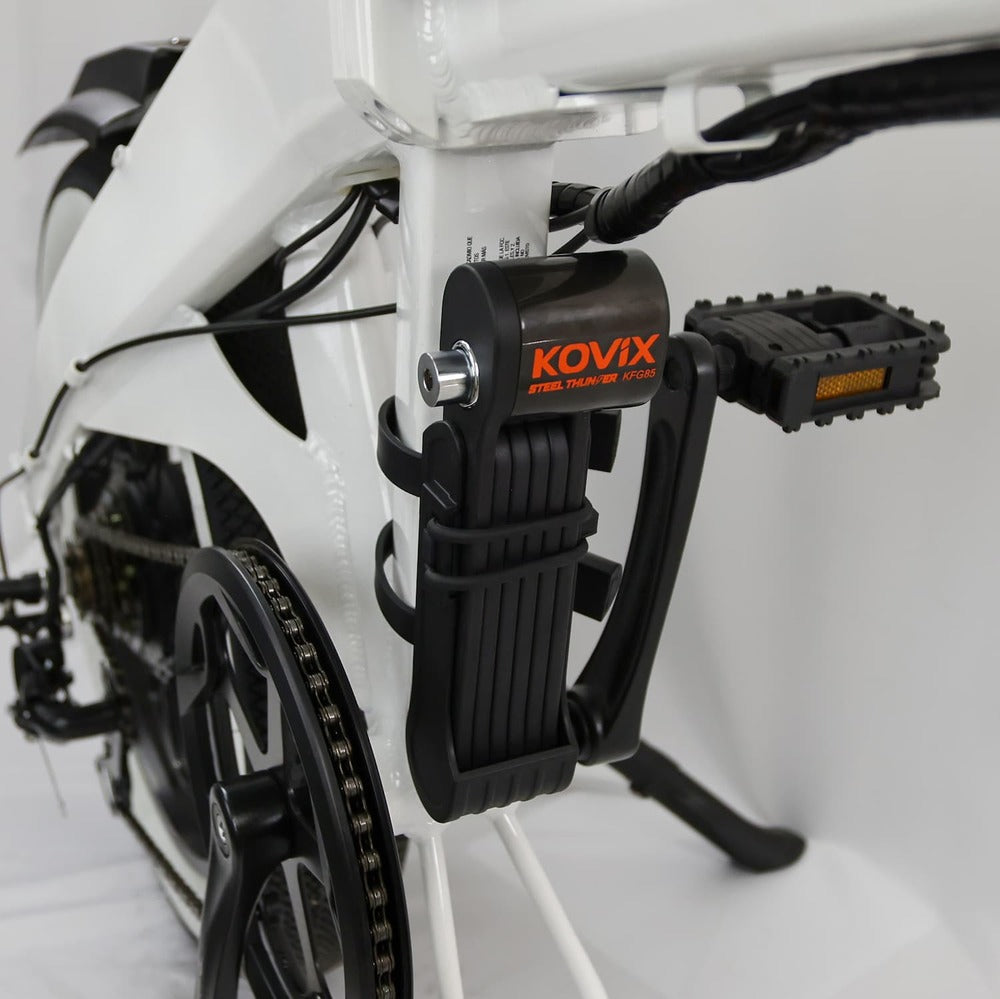 Jupiter_Kovix electric bike alarm lock attached to a white bicycle frame.
