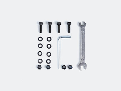 Velowave_Set of tools for assembling rear rack and includes screws, bolts, and wrenches on a white background