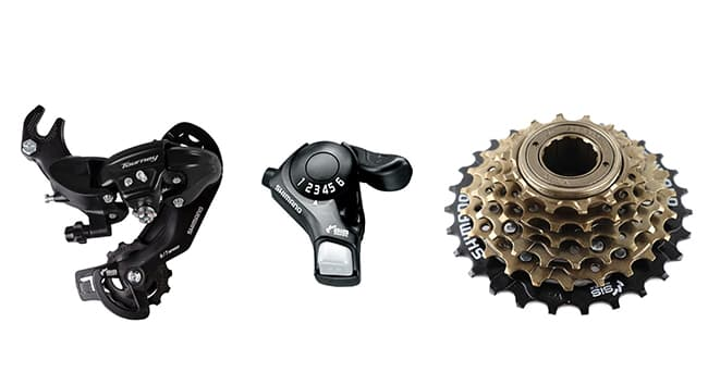 Jupiter_Discovery x7 Bicycle gear components including a derailleur, shifter, and gears on a white background